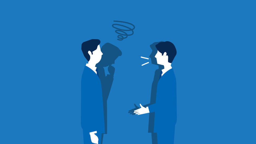 会話する二人のビジネスパーソン